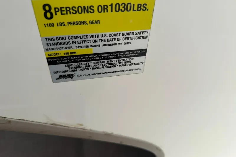 Slide: The Image of Capacity label for 2003 Bayliner 185, compliant with U.S. Coast Guard safety standards. - 17