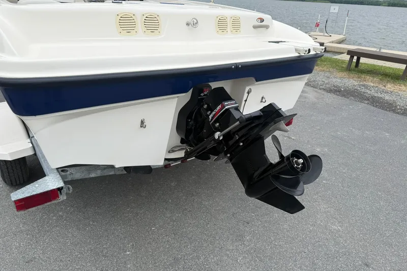Slide: The Image of Rear view of a 2003 Bayliner 185 boat with Mercury outboard motor. - 3