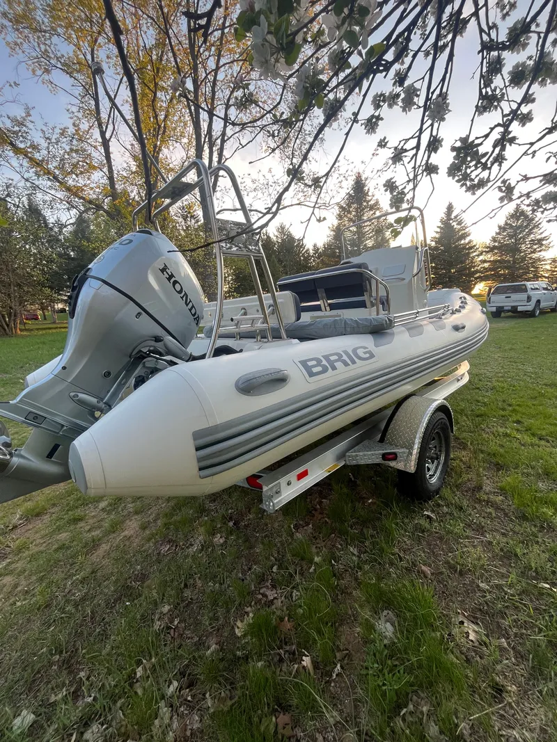 Slide: The Image of 2022 Brig Navigator 570 boat on trailer outdoors. - 10