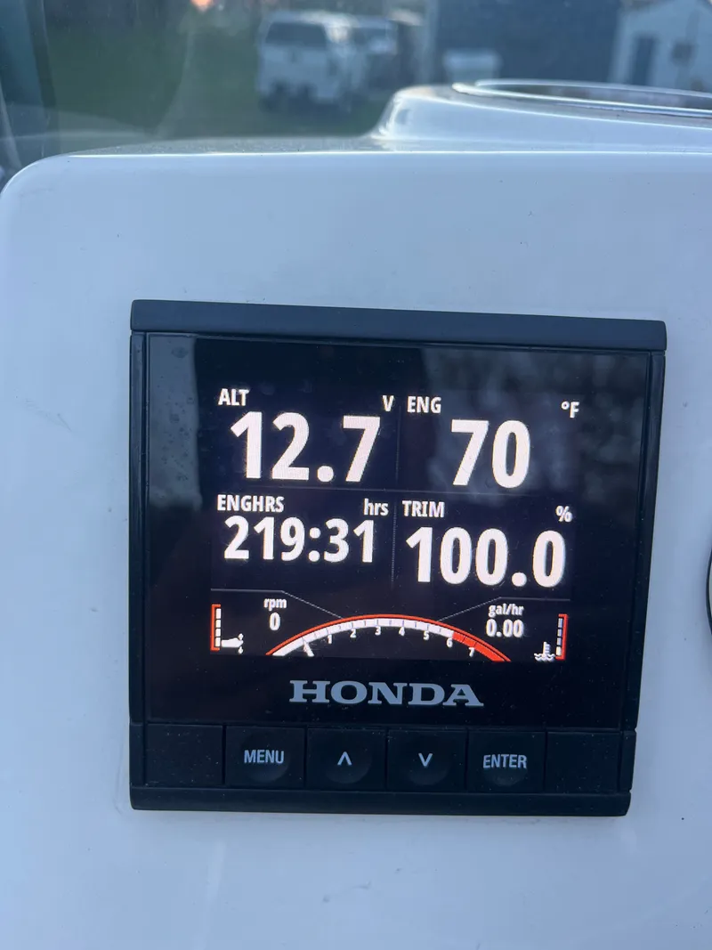 Slide: The Image of Honda display on Brig Navigator 570, 2022, showing 219 hours, 12.7V, 70°F. - 12