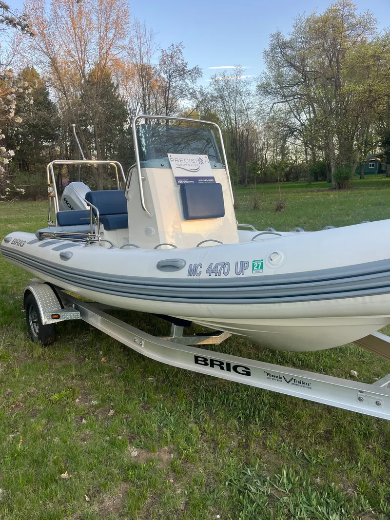 Slide: The Image of 2022 Brig Navigator 570 boat on trailer outdoors. - 2