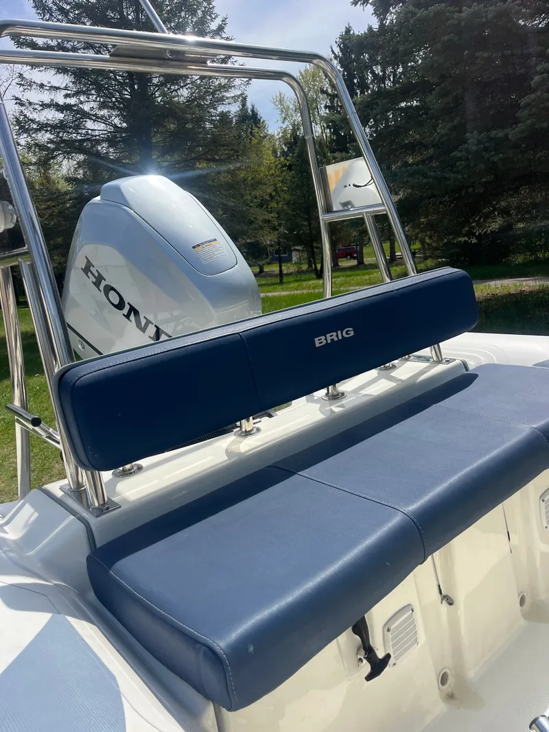 Slide: The Image of 2022 Brig Navigator 570 boat with Honda engine, blue seating. - 4