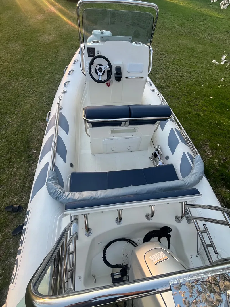 Slide: The Image of 2022 Brig Navigator 570 boat parked on grass. - 5