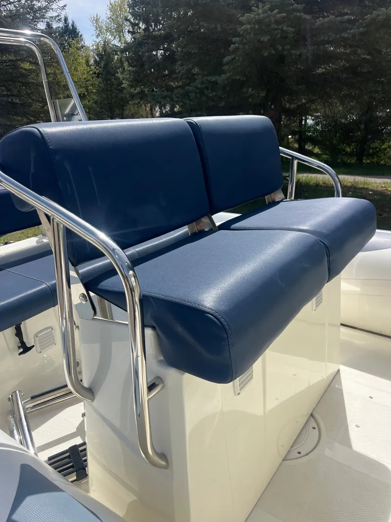 Slide: The Image of 2022 Brig Navigator 570 boat seat with blue upholstery. - 6