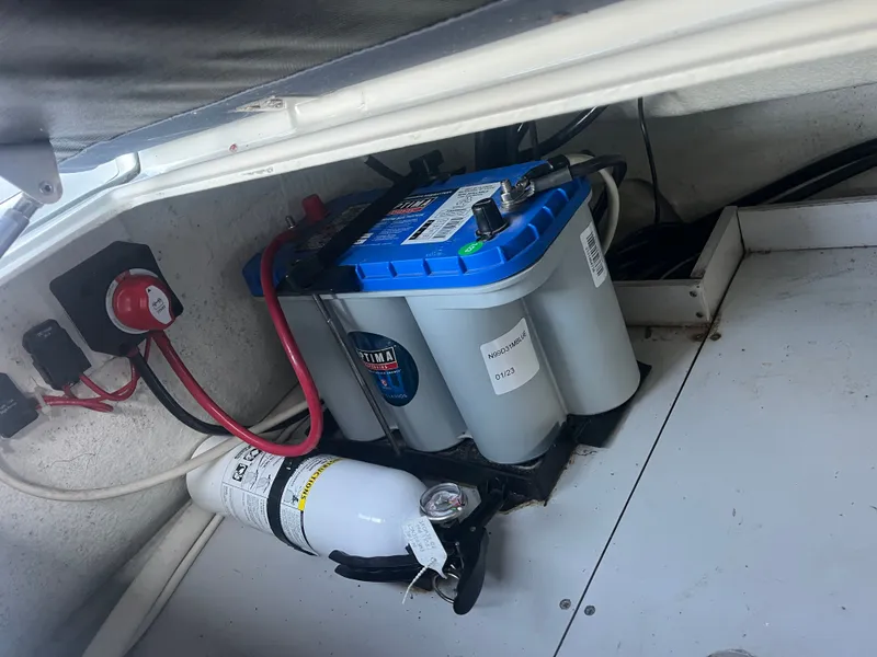 Slide: The Image of Battery and fire extinguisher in Brig Navigator 570 boat, year 2022. - 8