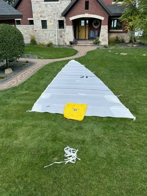 Slide: The Image of Sail on lawn in front of house, Beneteau First 24, 2021. - 11