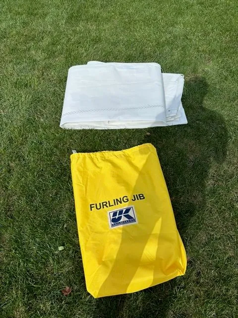 Slide: The Image of Beneteau First 24 Furling Jib on grass, yellow bag. - 12