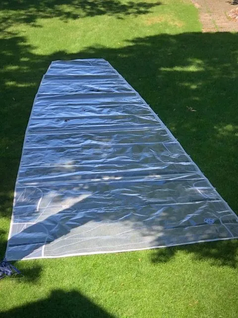 Slide: The Image of Sail for Beneteau First 24, 2021, spread on green grass. - 6