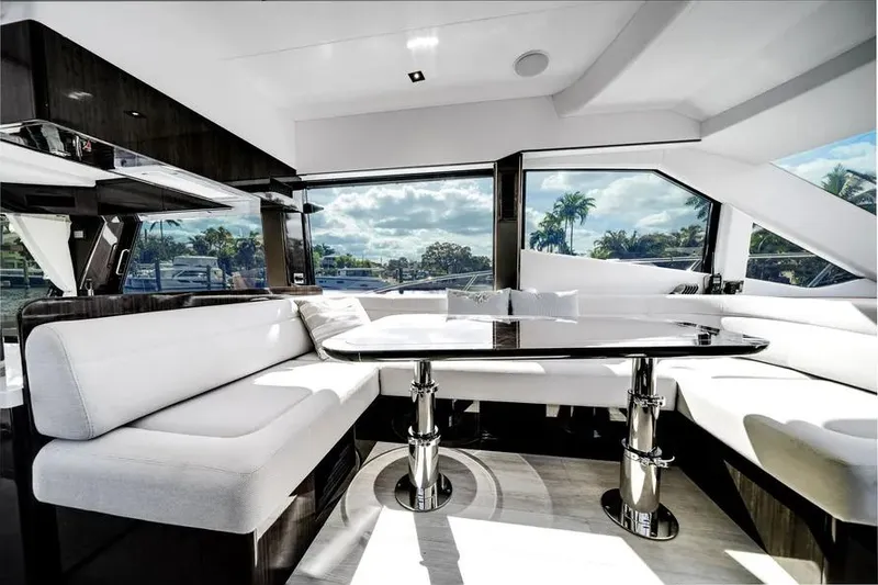 Slide: The Image of Luxurious interior of 2024 Galeon 500 Fly yacht with elegant seating and panoramic windows. - 17