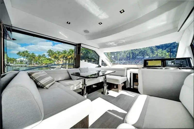 Slide: The Image of Luxurious interior of 2024 Galeon 500 Fly yacht with modern seating and panoramic windows. - 20