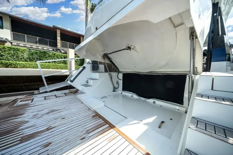 Slide: The Image of 2024 Galeon 500 Fly yacht with open storage compartment and sleek deck design. - 21