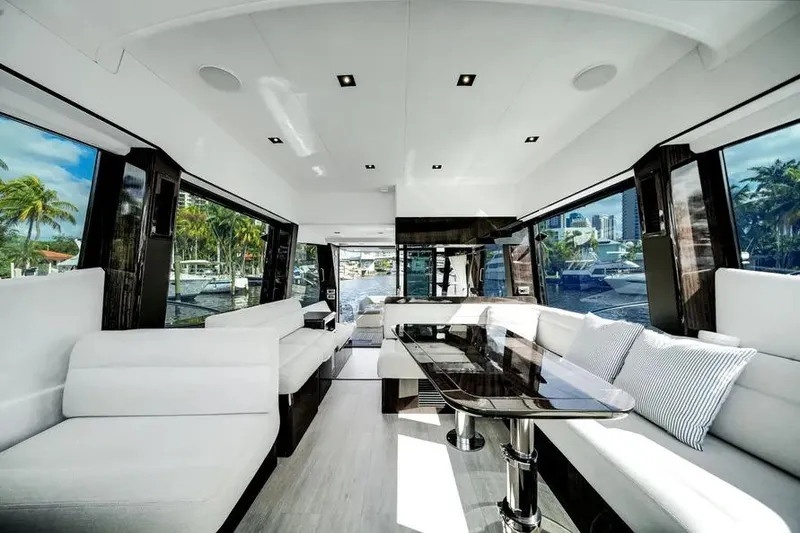 Slide: The Image of Luxurious interior of 2024 Galeon 500 Fly yacht with modern seating and panoramic windows. - 22