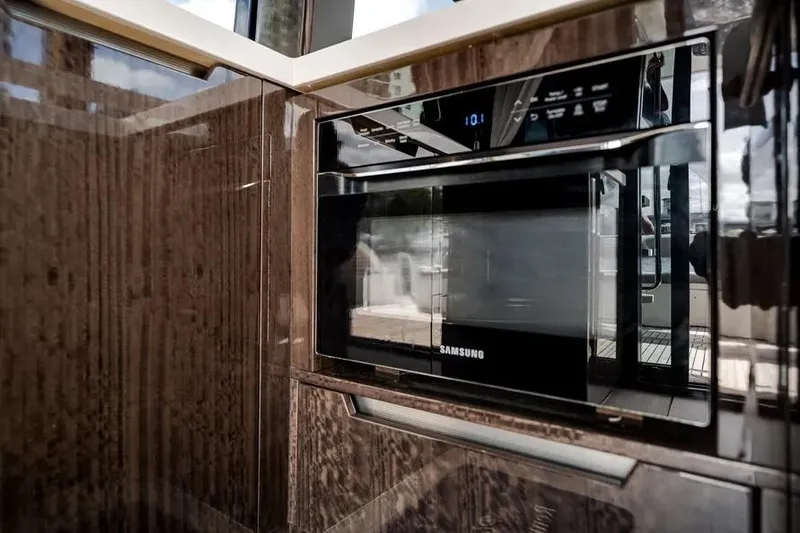 Slide: The Image of Luxury kitchen interior of 2024 Galeon 500 Fly yacht with Samsung microwave. - 24