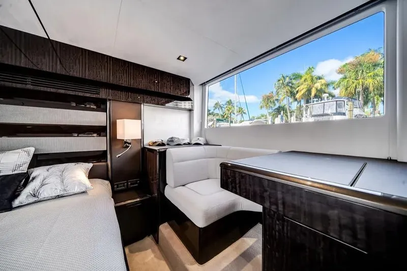 Slide: The Image of Luxurious interior of 2024 Galeon 500 Fly yacht with modern furnishings and large window view. - 36