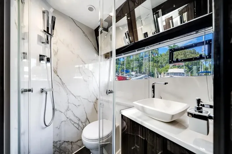 Slide: The Image of Luxurious bathroom in 2024 Galeon 500 Fly yacht with modern fixtures and marble accents. - 39