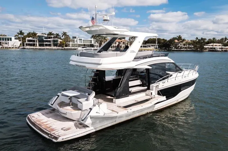 Slide: The Image of 2024 Galeon 500 Fly yacht on water, showcasing sleek design and luxury features. - 4