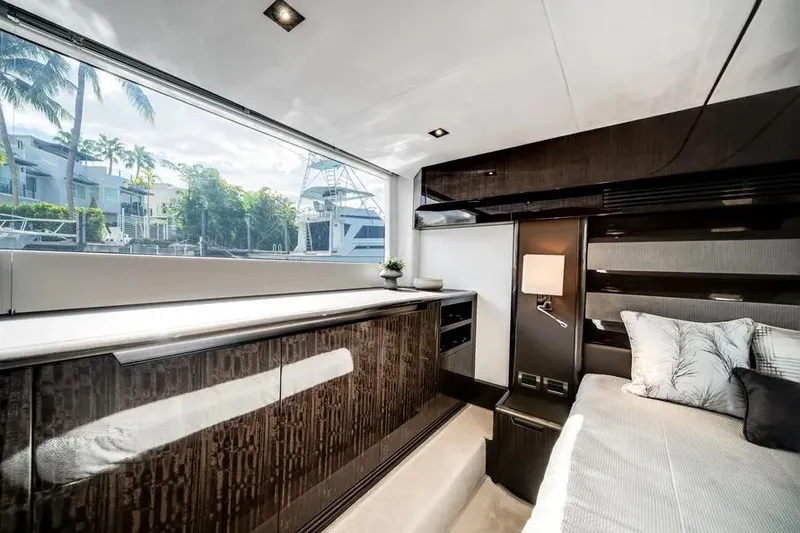 Slide: The Image of Luxurious interior of 2024 Galeon 500 Fly yacht with elegant wood finishes and large window. - 41