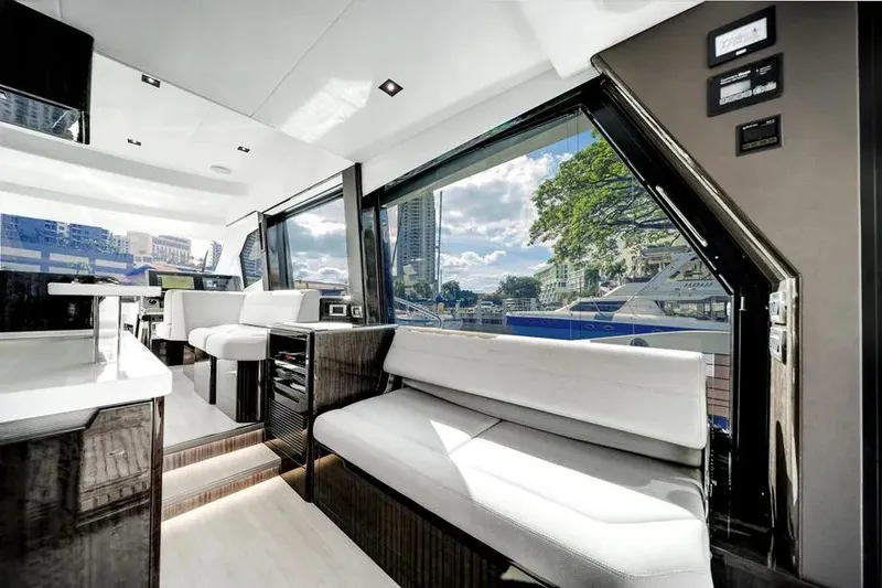 Slide: The Image of Luxurious interior of 2024 Galeon 500 Fly yacht with modern seating and large windows. - 46