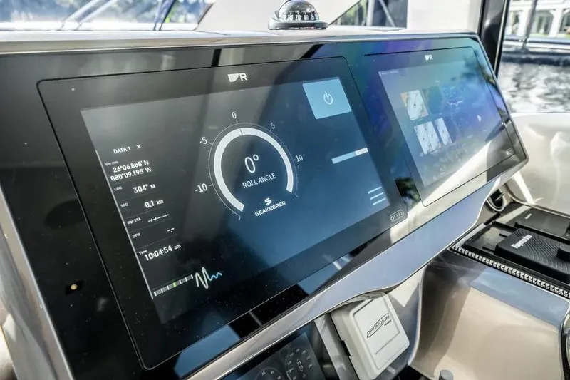 Slide: The Image of 2024 Galeon 500 Fly yacht dashboard with advanced navigation displays. - 49