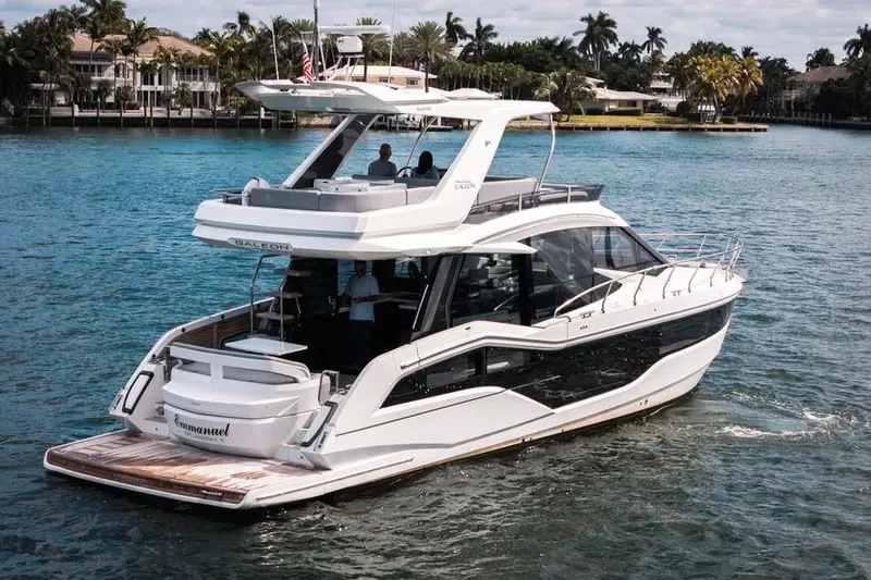 Slide: The Image of 2024 Galeon 500 Fly yacht cruising on a serene waterway, showcasing luxury and modern design. - 5