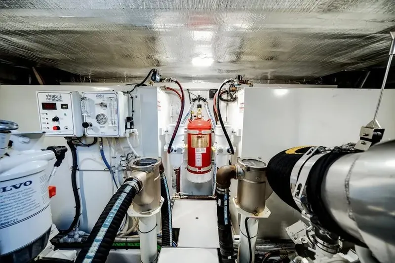 Slide: The Image of Engine room of 2024 Galeon 500 Fly yacht, featuring advanced equipment and fire extinguisher. - 54