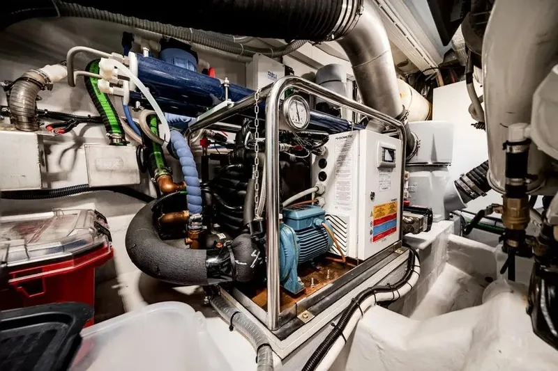 Slide: The Image of Engine room of 2024 Galeon 500 Fly yacht, showcasing complex machinery and piping. - 55