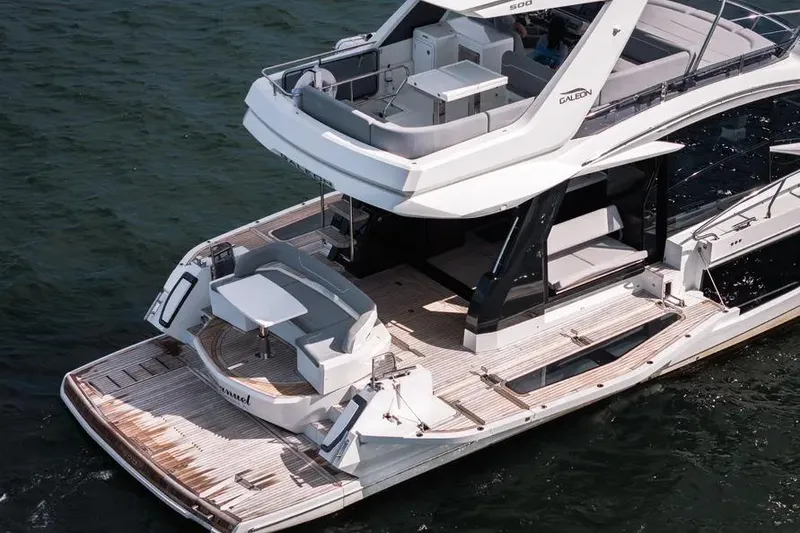 Slide: The Image of 2024 Galeon 500 Fly yacht with spacious deck and modern design on the water. - 6