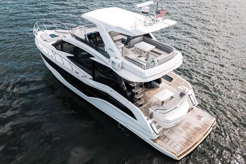 Slide: The Image of 2024 Galeon 500 Fly yacht cruising on open water, showcasing luxurious design and spacious decks. - 7
