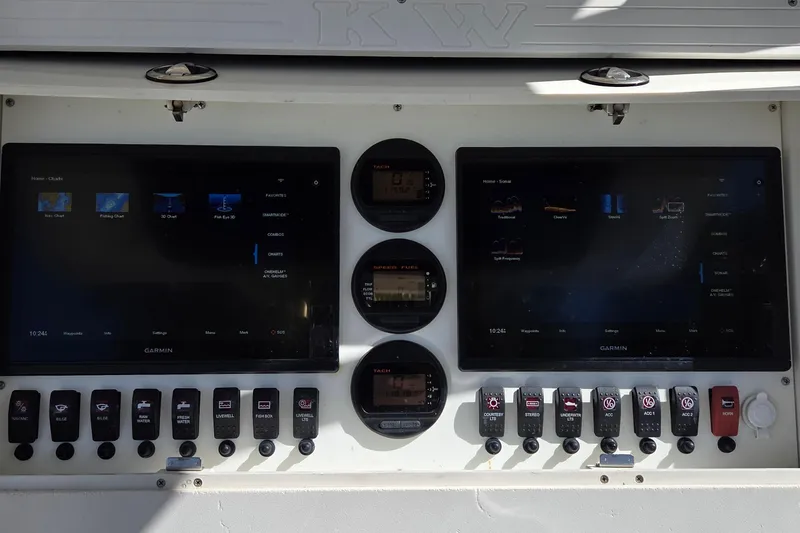 Slide: The Image of Control panel of a 2008 Key West 293 Center Console boat with Garmin displays. - 16