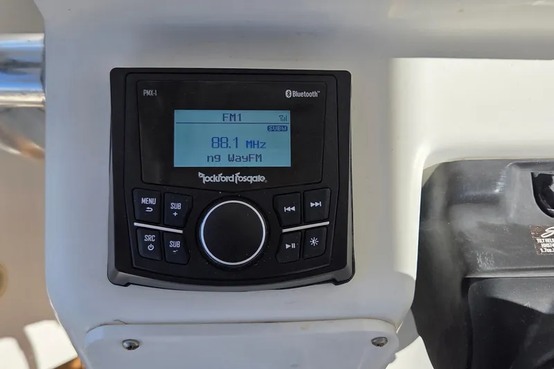 Slide: The Image of Rockford Fosgate stereo system on 2008 Key West 293 Center Console boat dashboard. - 19