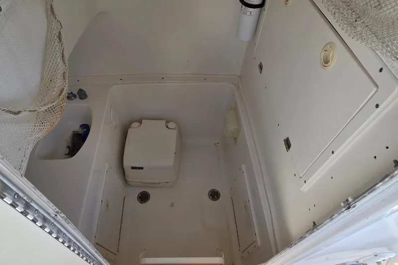 Slide: The Image of Interior of 2008 Key West 293 Center Console boat with portable toilet. - 7