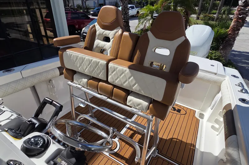 Slide: The Image of 2008 Key West 293 Center Console boat with luxurious seating and modern helm design. - 8
