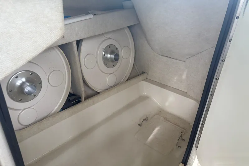 Slide: The Image of Interior storage compartment of a 2001 Sea Ray 210 Sundeck boat. - 6