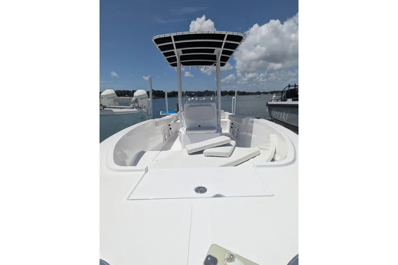 Slide: The Image of Clearwater 2000 Center Console boat, 2026 model, on calm waters. - 6