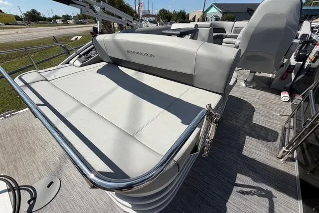 Slide: The Image of 2021 Bennington L22 pontoon boat with spacious seating and sleek design. - 15