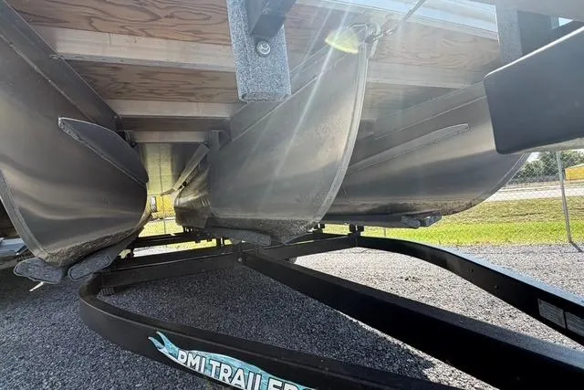 Slide: The Image of Underneath view of a 2021 Bennington L22 pontoon boat on a trailer. - 7