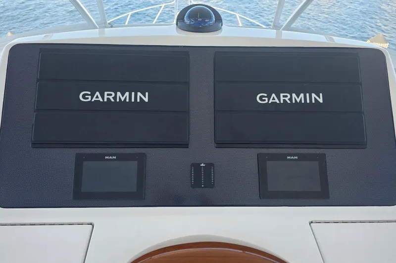 Slide: The Image of Control panel of 2022 Viking 48 Convertible yacht with Garmin displays. - 28