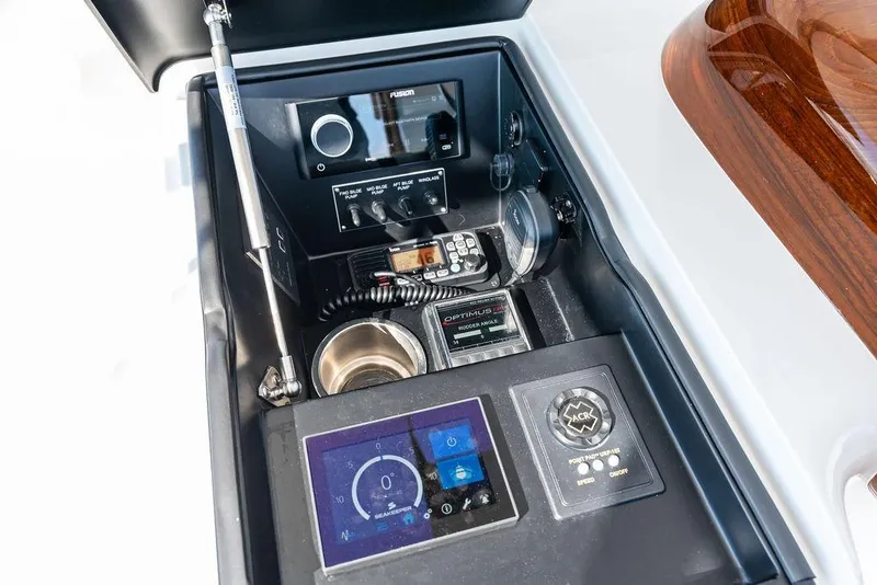 Slide: The Image of Control panel of 2022 Viking 48 Convertible yacht with advanced navigation and communication systems. - 32