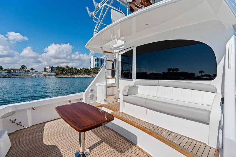 Slide: The Image of 2022 Viking 48 Convertible yacht with spacious deck, luxurious seating, and ocean view. - 35