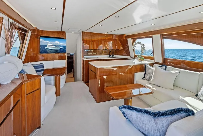 Slide: The Image of Luxurious interior of 2022 Viking 48 Convertible yacht with elegant wood finishes and ocean view. - 41