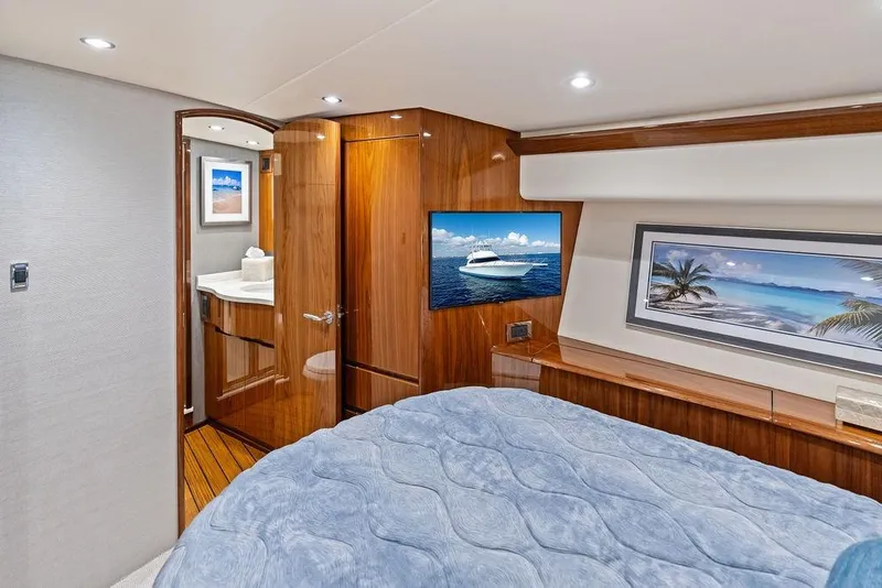 Slide: The Image of Luxurious 2022 Viking 48 Convertible yacht interior with elegant wood finishes and modern amenities. - 55