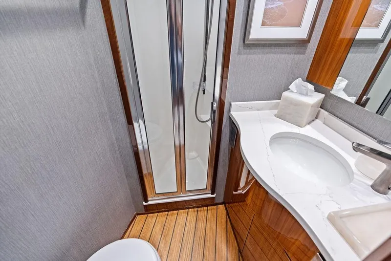 Slide: The Image of Luxurious bathroom in 2022 Viking 48 Convertible yacht with modern fixtures and elegant design. - 56