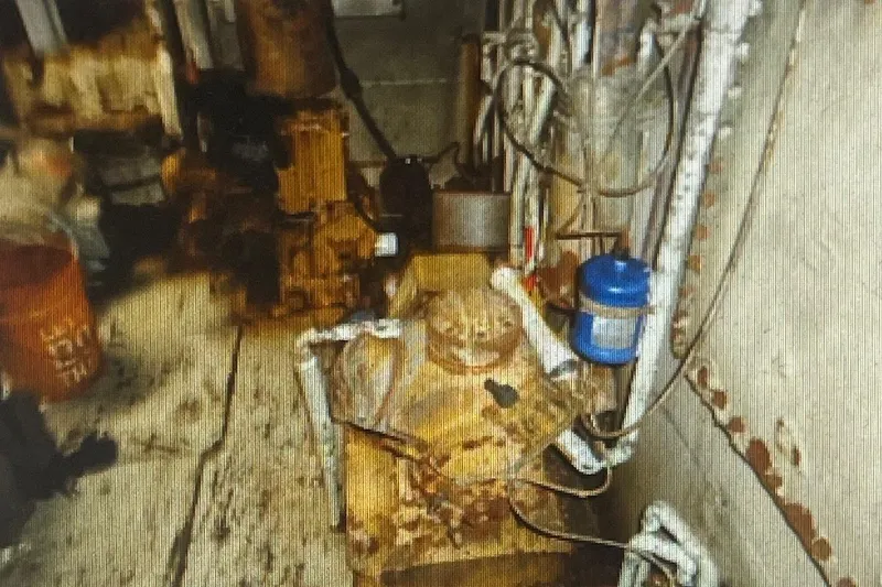 Slide: The Image of Interior machinery of a 1987 Commercial Freezer Shrimp Trawler, showing pipes and equipment. - 5