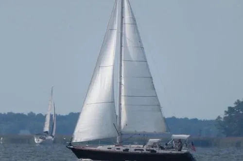 The Image of Sailing yacht Sabre 38, 1993 model, gliding on open water with full sails. - 0