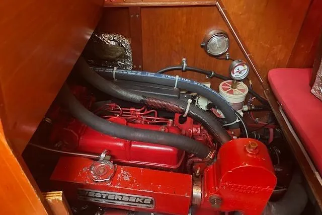 Slide: The Image of Engine compartment of a 1993 Sabre 38 sailboat with a red Westerbeke engine. - 14
