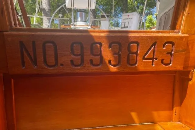 Slide: The Image of 1993 Sabre 38 boat interior with registration number 993843 engraved on wood. - 15