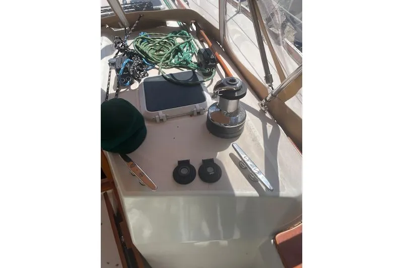 Slide: The Image of Deck of 1993 Sabre 38 sailboat with winch, ropes, and cleats. - 16