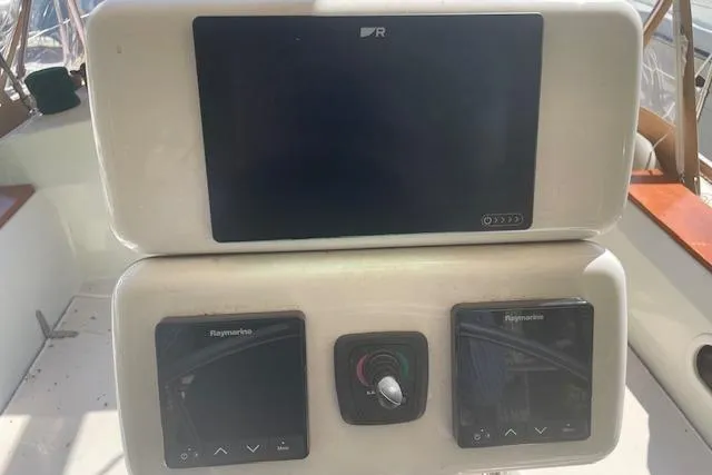 Slide: The Image of Control panel of a 1993 Sabre 38 sailboat with Raymarine displays. - 20