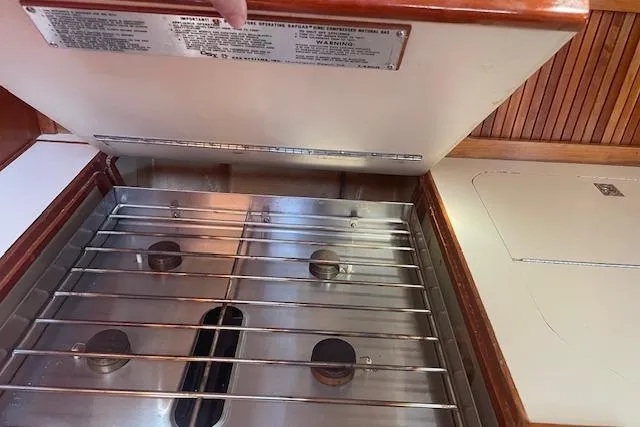 Slide: The Image of Stainless steel stove in 1993 Sabre 38 yacht kitchen, with wooden accents. - 6