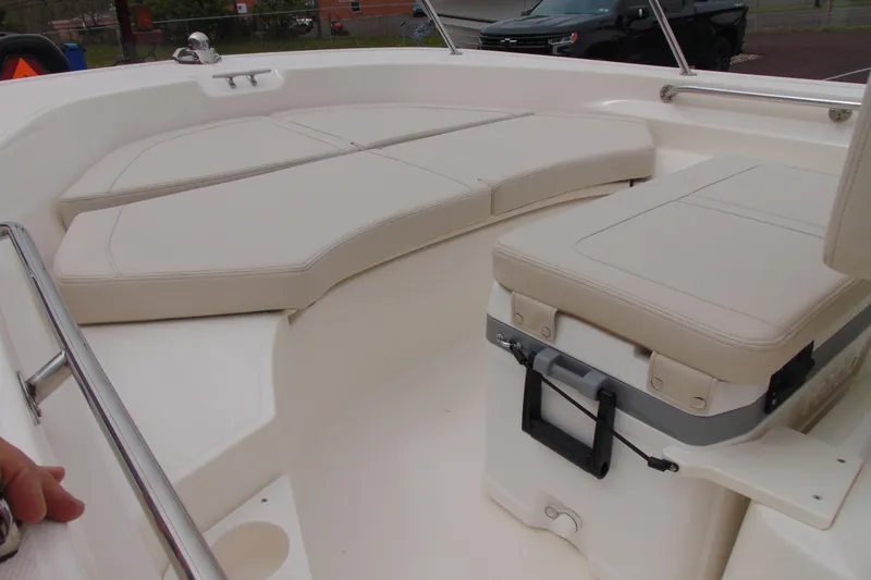 Slide: The Image of 2026 Boston Whaler 170 Montauk boat interior with cushioned seating and storage. - 12